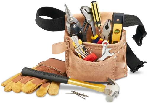 A tool belt with tools in the pouches and gloves, a hammer and nails sitting next to it